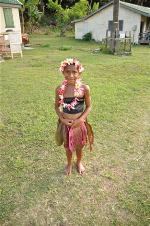 Traditional dress of a young girl readt to perform her meke. By Jane
