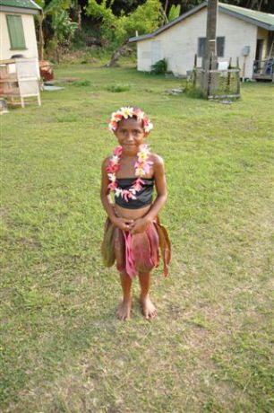 Traditional dress of a young girl readt to perform her meke. By Jane