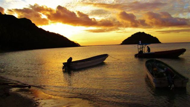 Sunset before the night dive at Makogai. By Ron