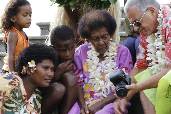 James showing the village ladies his underwater photos - captured by Patrick