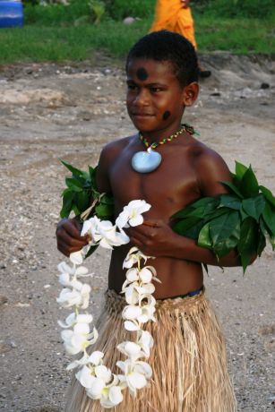 Young warrior greets us warmly at Makogai: taken by Randy