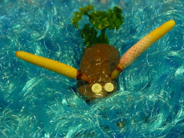 Trip mascot on an afro. Looks a bit like a cross between a nudibranch and a...? - by Willa